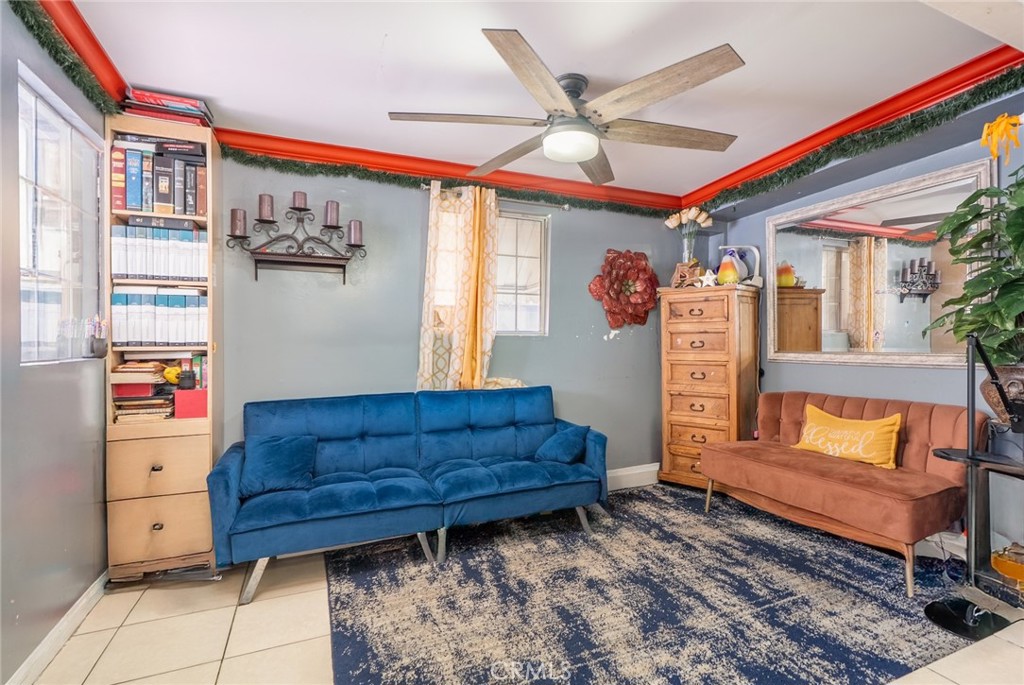 16002 Atlantic Avenue, Unit C11 Compton, CA 90221 - Photo 4 of 19 a living room with furniture and a rug