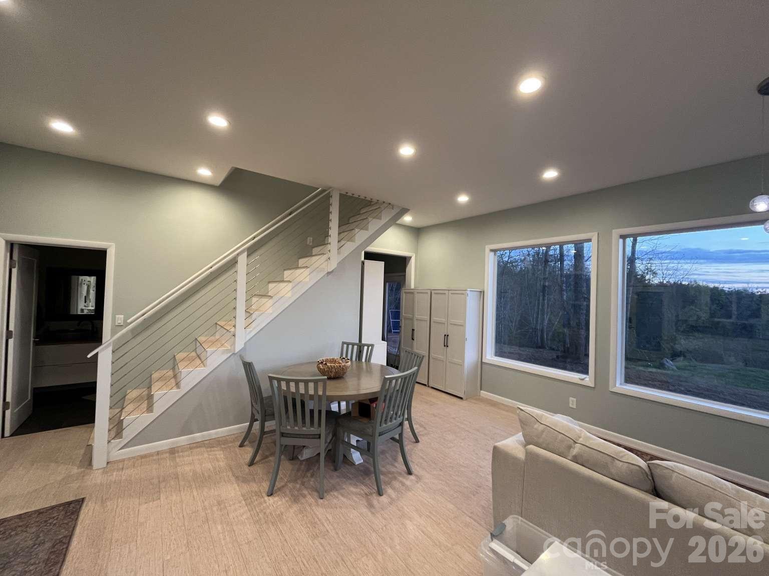 3445 Irish Hills Road Morganton, NC 28655 - Photo 12 of 34 a dining room with furniture and a floor to ceiling window