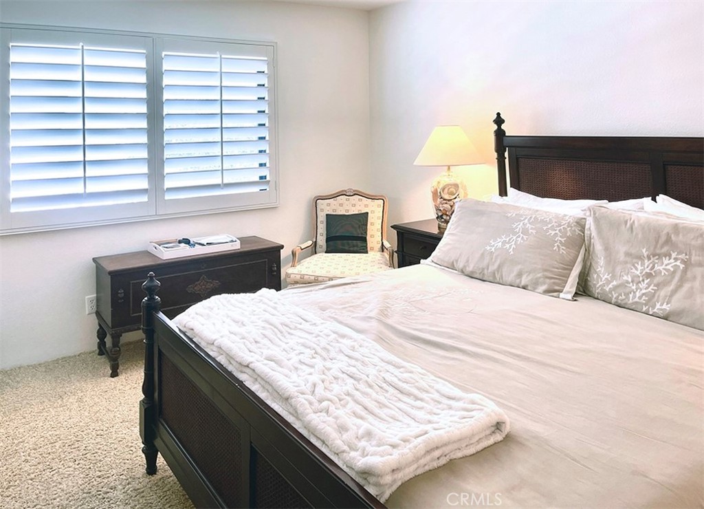 8 Cadiz Drive Rancho Mirage, CA 92270 - Photo 11 of 26 a bedroom with a bed and a desk