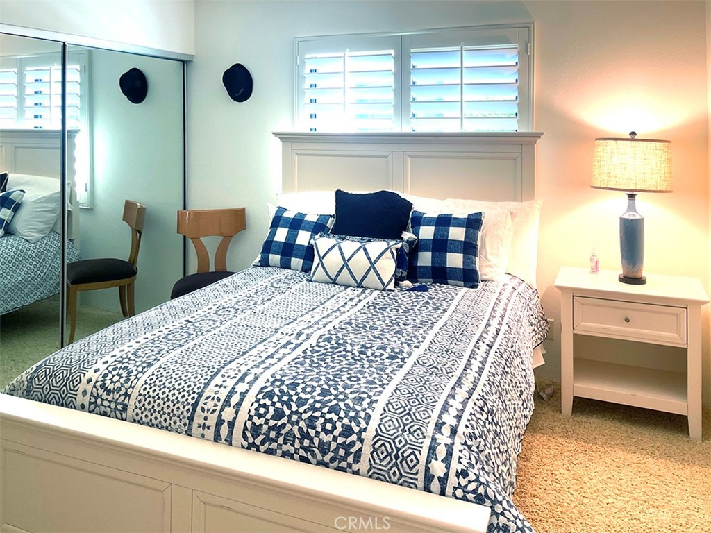 8 Cadiz Drive Rancho Mirage, CA 92270 - Photo 12 of 26 a bed room with a bed and a chair