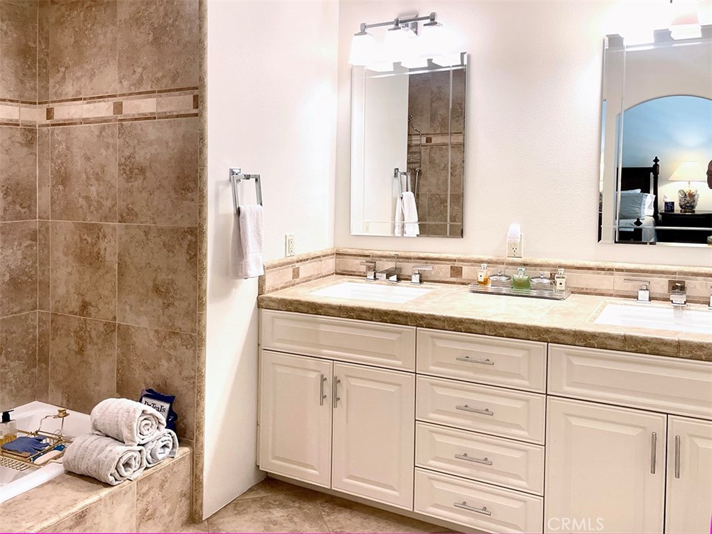 8 Cadiz Drive Rancho Mirage, CA 92270 - Photo 15 of 26 a bathroom with a sink and mirror