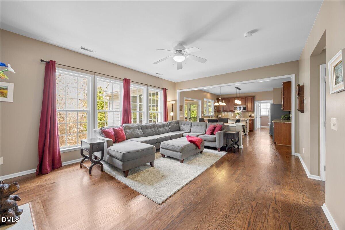 7728 Silver View Lane Raleigh, NC 27613 - Photo 12 of 53 a living room with furniture and a large window