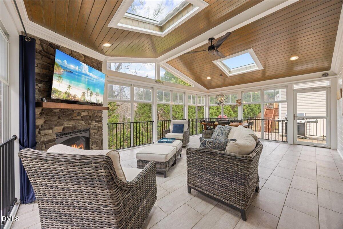7728 Silver View Lane Raleigh, NC 27613 - Photo 18 of 53 a living room with furniture floor to ceiling window and floor to ceiling window