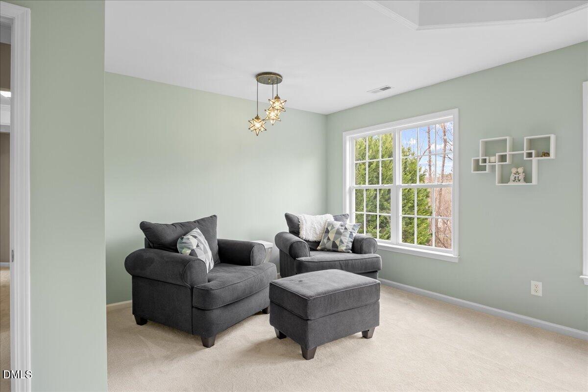 7728 Silver View Lane Raleigh, NC 27613 - Photo 22 of 53 a living room with furniture and a window