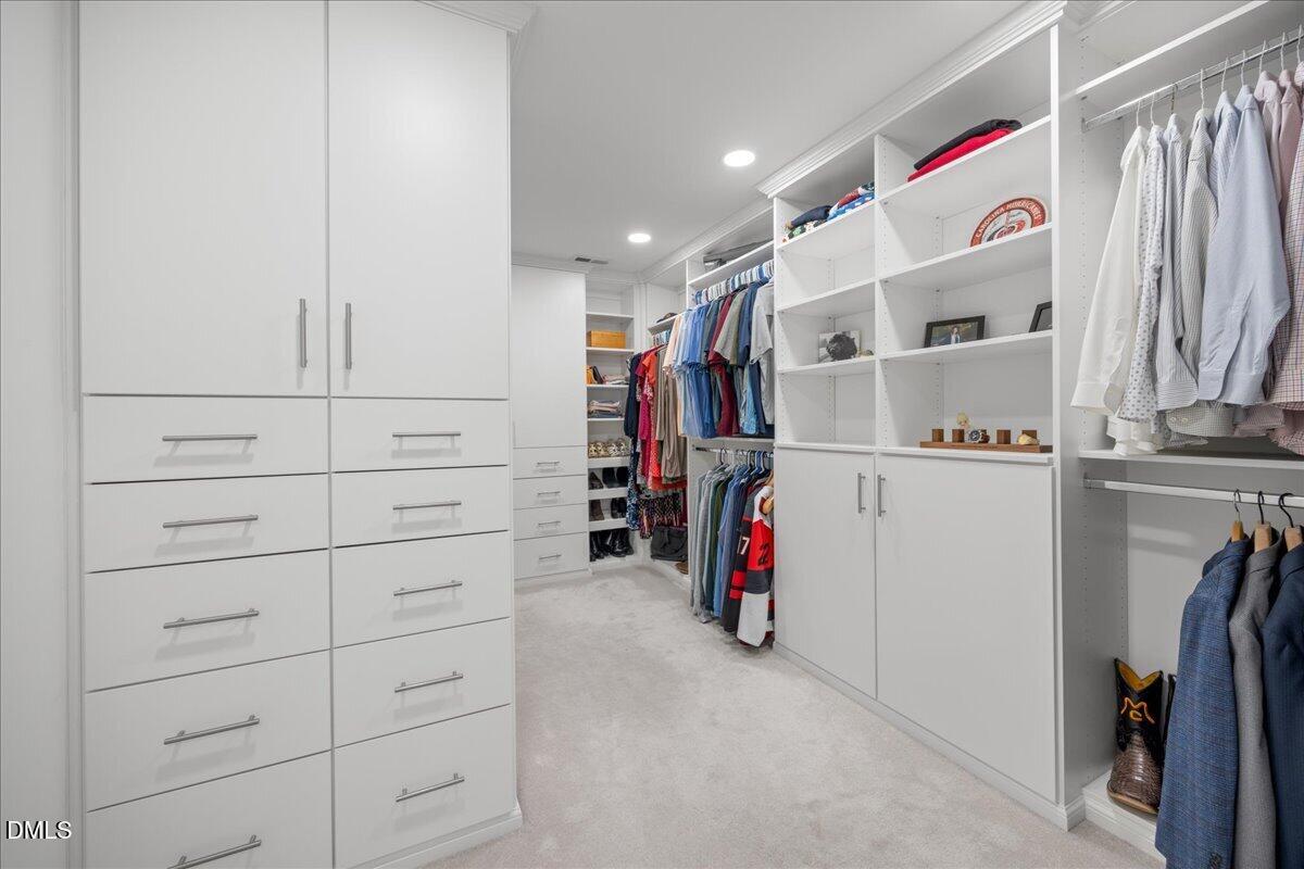 7728 Silver View Lane Raleigh, NC 27613 - Photo 27 of 53 a view of walk in closet with clothes and shoes