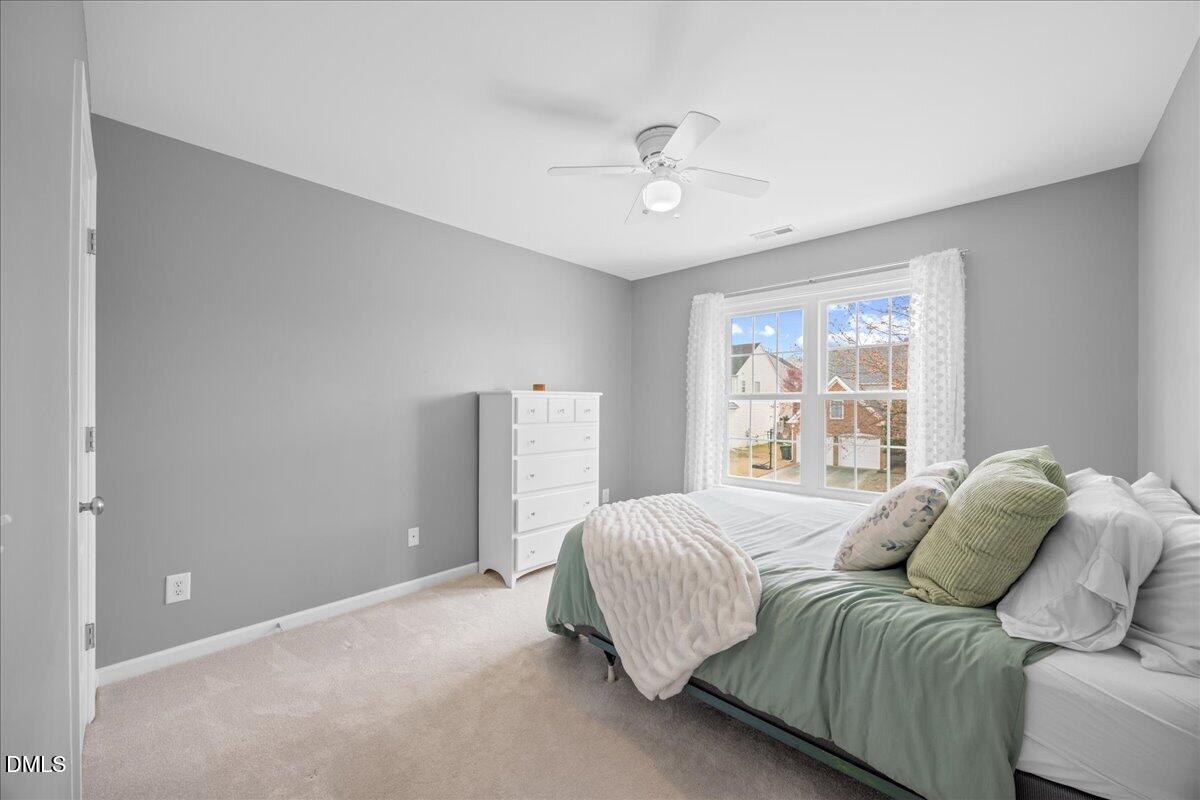 7728 Silver View Lane Raleigh, NC 27613 - Photo 33 of 53 a bedroom with a bed and a window