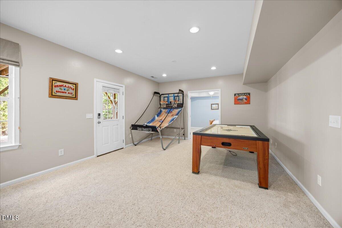 7728 Silver View Lane Raleigh, NC 27613 - Photo 36 of 53 a room with furniture and a wooden floor