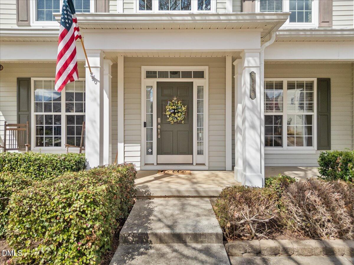 7728 Silver View Lane Raleigh, NC 27613 - Photo 3 of 53 a front view of a house with a porch
