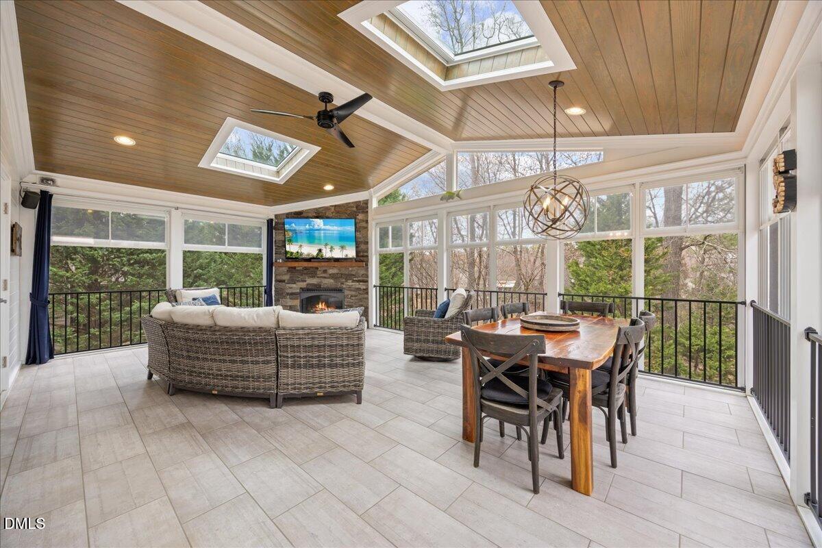 7728 Silver View Lane Raleigh, NC 27613 - Photo 4 of 53 a dining room with furniture and a large window