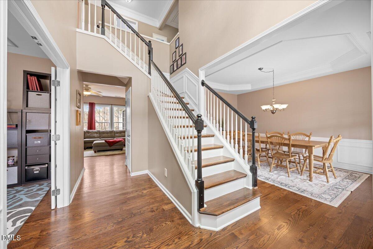 7728 Silver View Lane Raleigh, NC 27613 - Photo 5 of 53 a view of entryway and hall with wooden floor