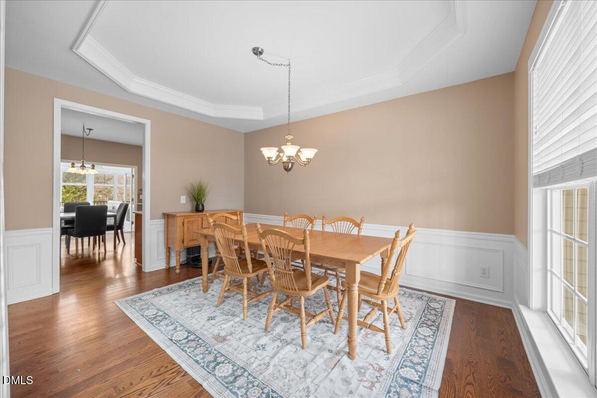 7728 Silver View Lane Raleigh, NC 27613 - Photo 6 of 53 a view of a dining room with furniture and wooden floor