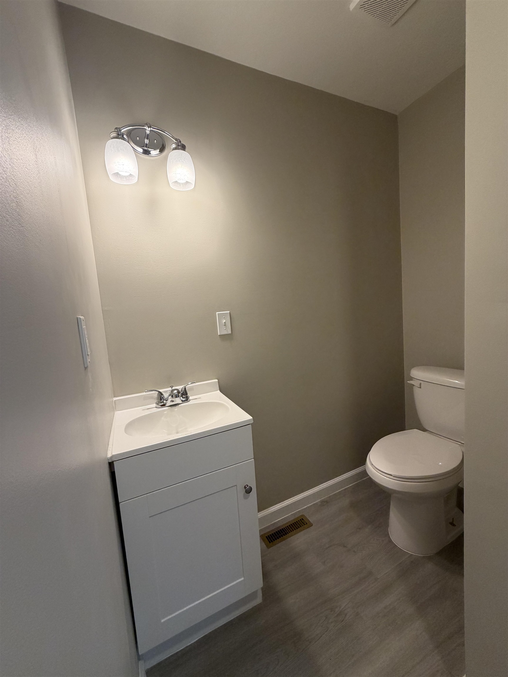 224 Kellar Avenue Ripley, TN 38063 - Photo 16 of 30 a bathroom with a toilet sink and mirror