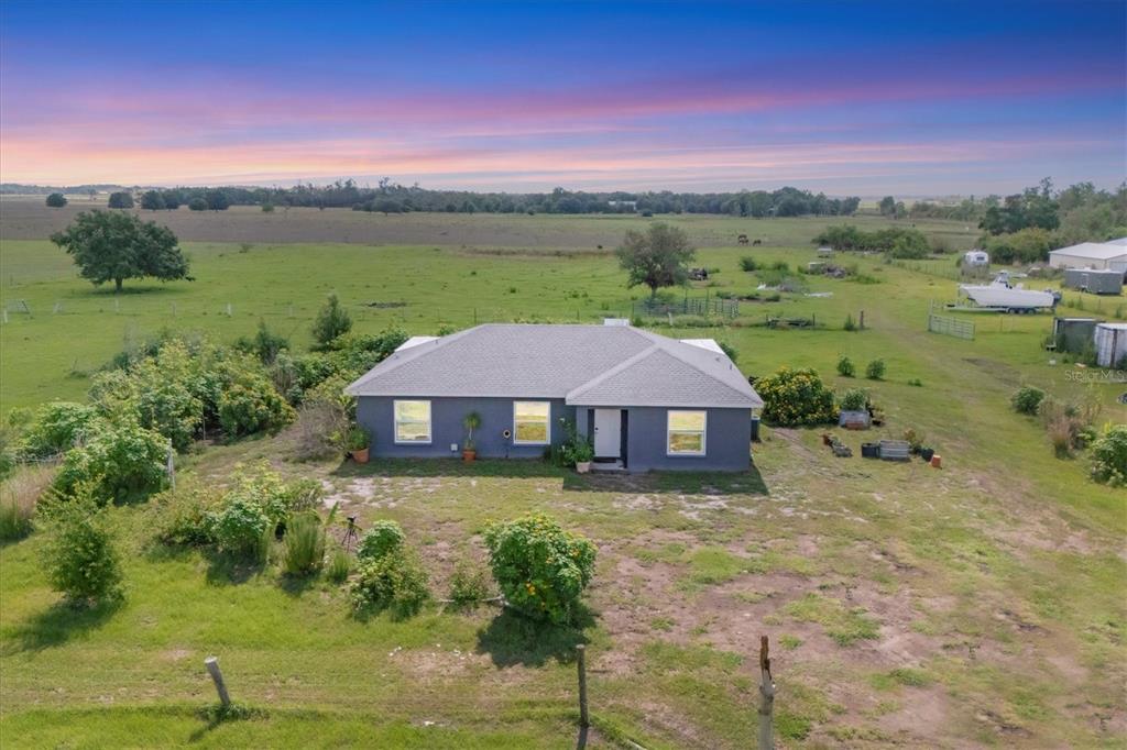 7745 Wauchula Road Myakka City, FL 34251 - Photo 1 of 44 a view of a big house with a big yard