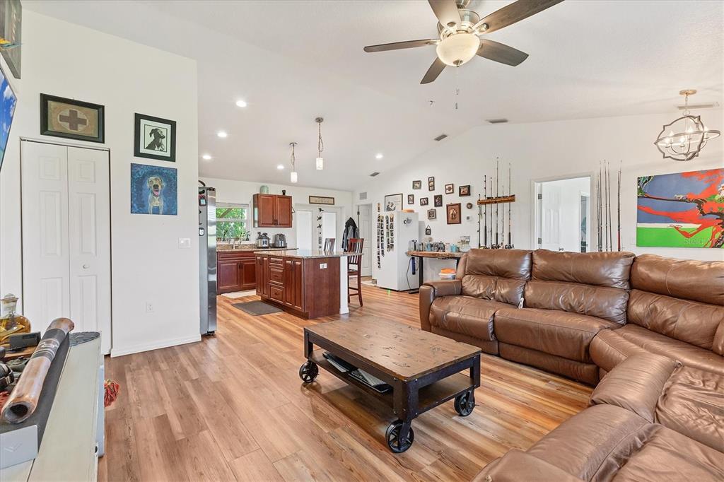 7745 Wauchula Road Myakka City, FL 34251 - Photo 13 of 44 a living room with furniture and a wooden floor
