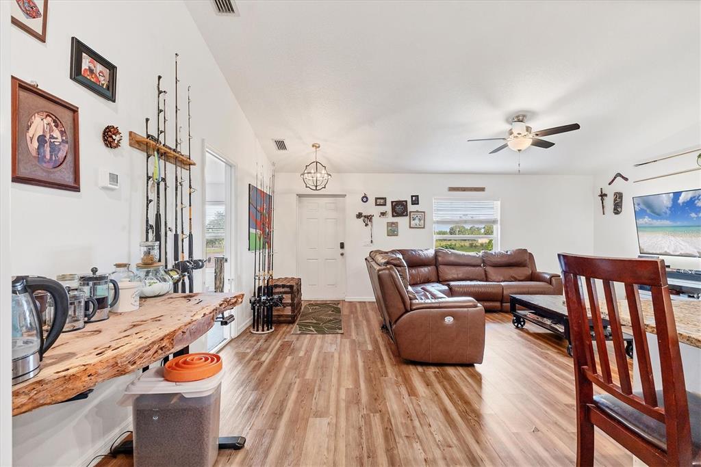 7745 Wauchula Road Myakka City, FL 34251 - Photo 22 of 44 a reading room with furniture and wooden floor