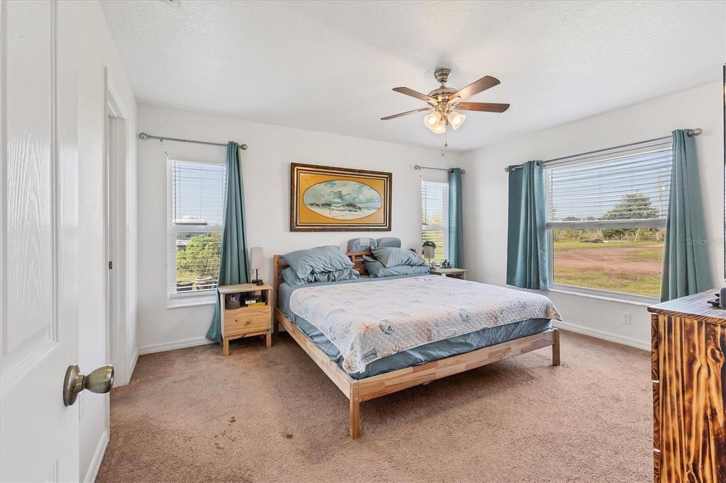 7745 Wauchula Road Myakka City, FL 34251 - Photo 23 of 44 a bed room with a bed and a window