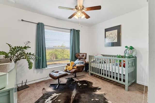 a bedroom with furniture and a window