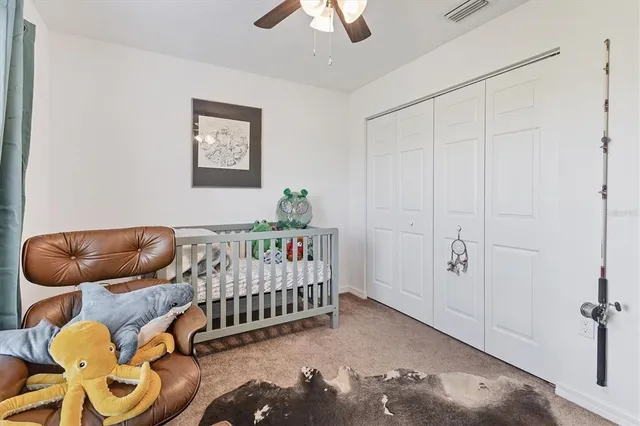 a bedroom with furniture and a window