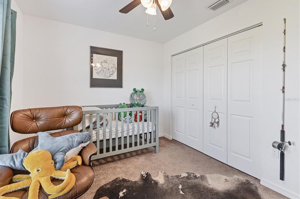 7745 Wauchula Road Myakka City, FL 34251 - Photo 28 of 44 a bedroom with furniture and a window
