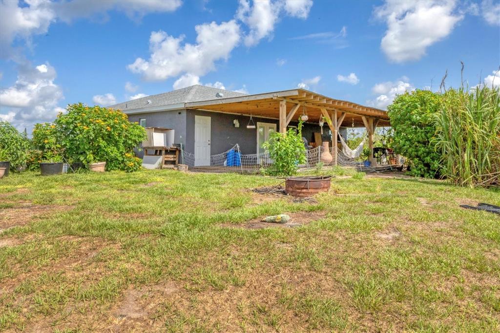 7745 Wauchula Road Myakka City, FL 34251 - Photo 36 of 44 a view of a house with a yard