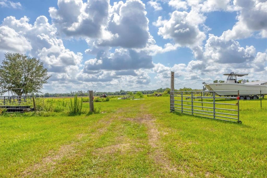 7745 Wauchula Road Myakka City, FL 34251 - Photo 37 of 44 a view of a lake with houses in the back