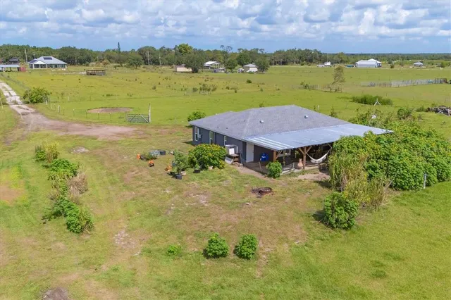 a view of a lake with a house in the background