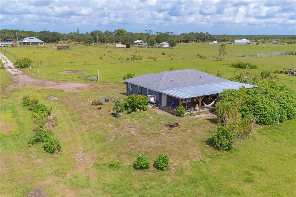 7745 Wauchula Road Myakka City, FL 34251 - Photo 40 of 44 a view of a lake with a house in the background