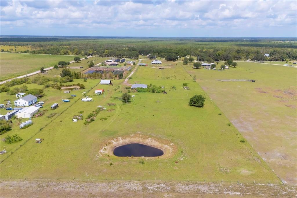 7745 Wauchula Road Myakka City, FL 34251 - Photo 42 of 44 a view of a lake with a building