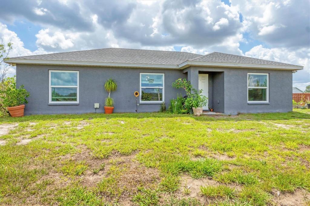 7745 Wauchula Road Myakka City, FL 34251 - Photo 8 of 44 a view of a house with a swimming pool