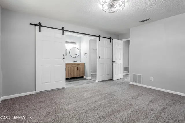 a view of a pathway with a backyard