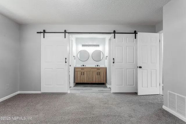 a view of a house with a yard and porch