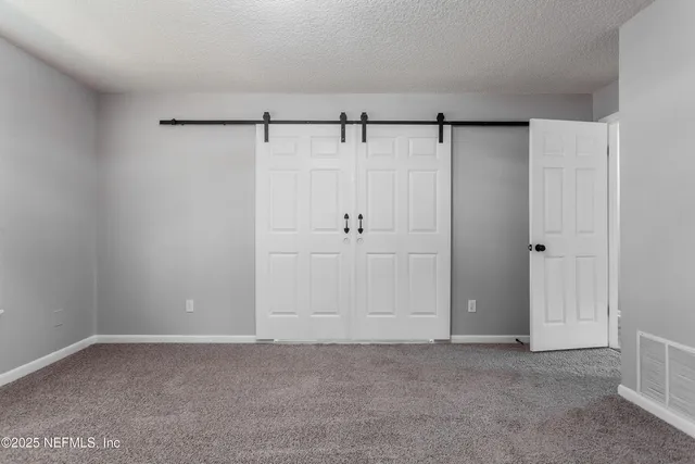 a house view with swimming pool in front of it