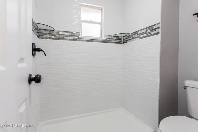 a view of a house with a large trees