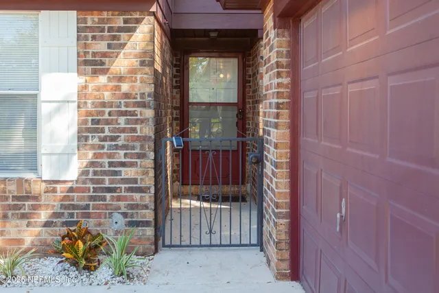 a view of a kitchen with a sink and a window
