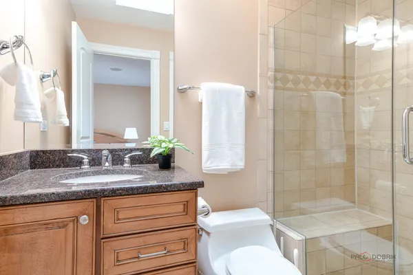 a view of a livingroom with furniture and a flat screen tv