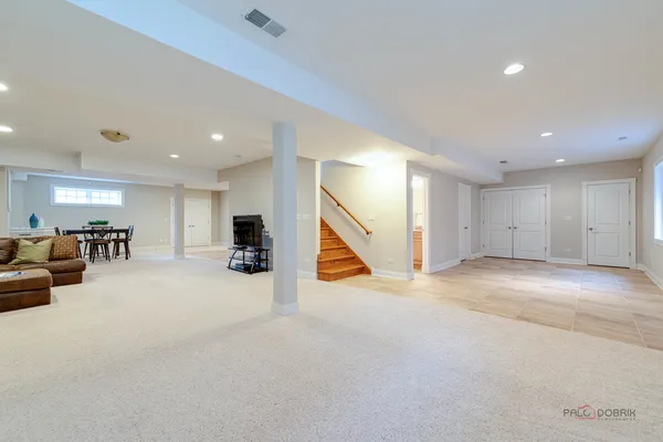 a view of a dining room with furniture and a window