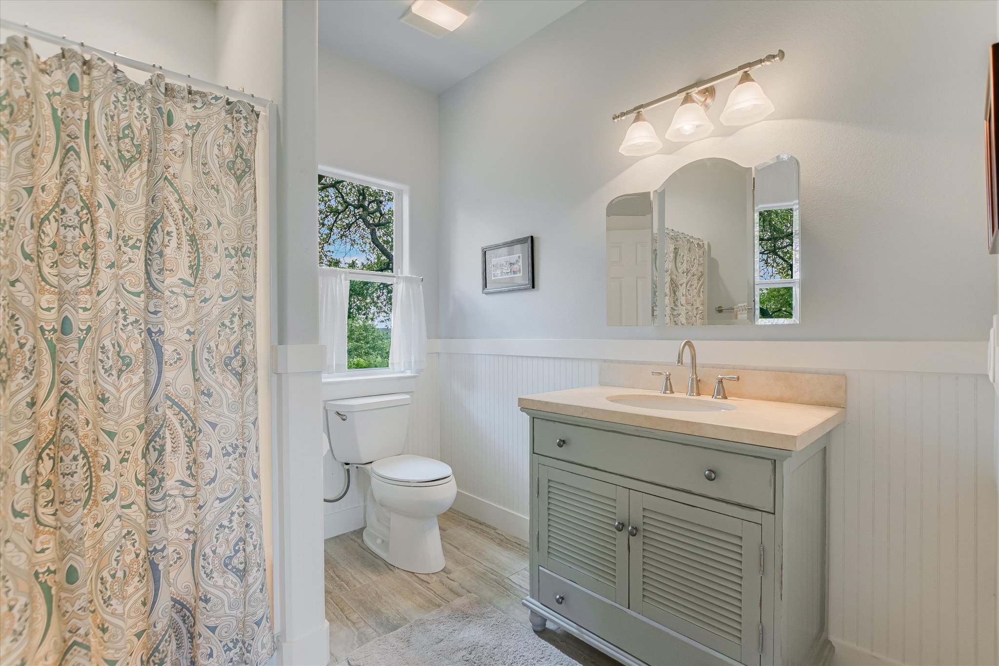 590 Rancho Grande Drive Wimberley, TX 78676 - Photo 21 of 30 a bathroom with a toilet sink and mirror