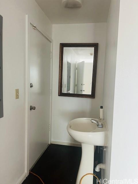 1728 Dillingham Boulevard, Unit B Honolulu, HI 96819 - Photo 14 of 15 a bathroom with a sink and a mirror