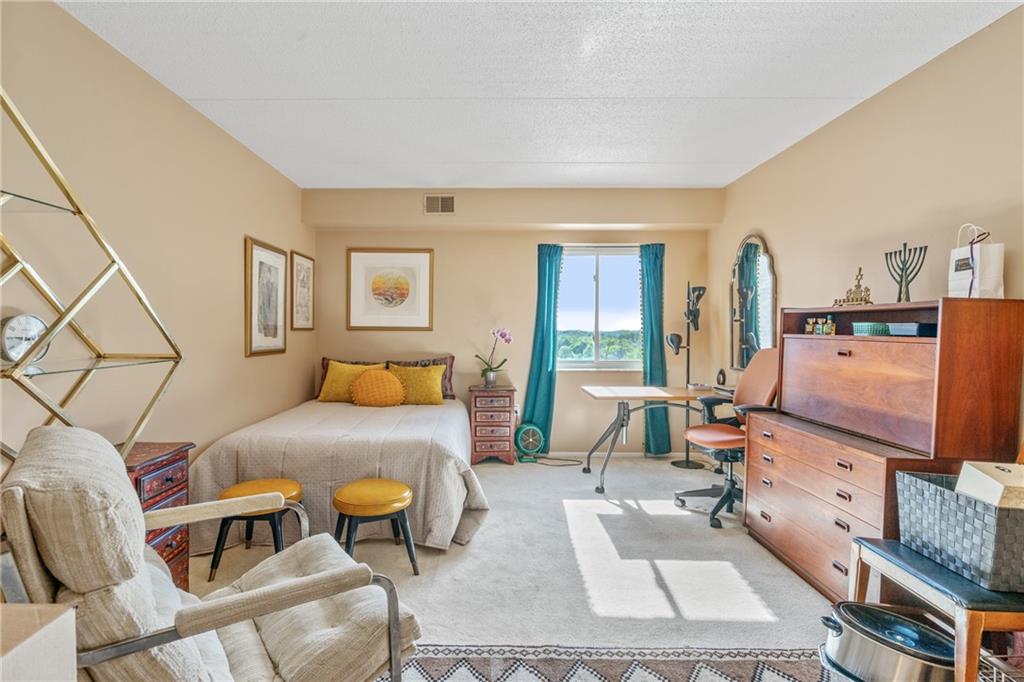 5600 Munhall Road, Unit 816 Pittsburgh, PA 15217 - Photo 12 of 20 a bedroom with furniture and a wooden floor