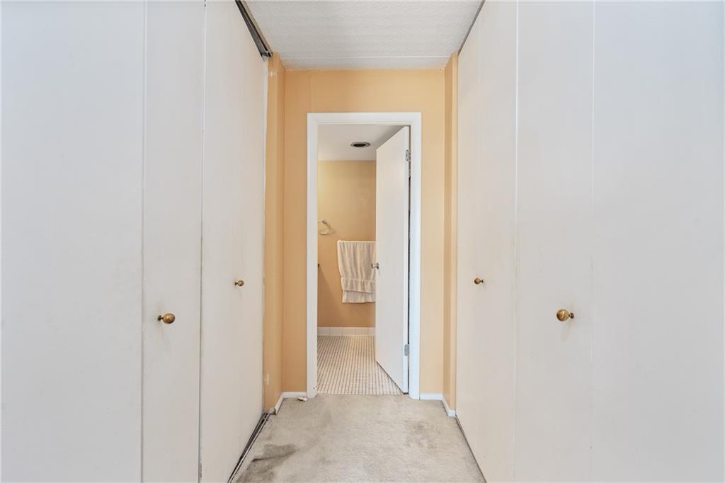 5600 Munhall Road, Unit 816 Pittsburgh, PA 15217 - Photo 13 of 20 a view of a hallway with a wooden door