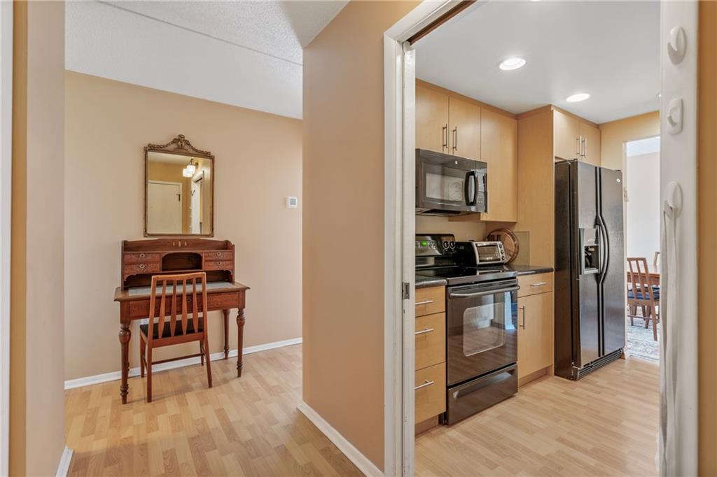 5600 Munhall Road, Unit 816 Pittsburgh, PA 15217 - Photo 2 of 20 a kitchen with stainless steel appliances granite countertop a refrigerator and a stove top oven