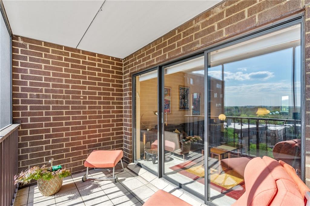 5600 Munhall Road, Unit 816 Pittsburgh, PA 15217 - Photo 6 of 20 a balcony with chairs and glass door