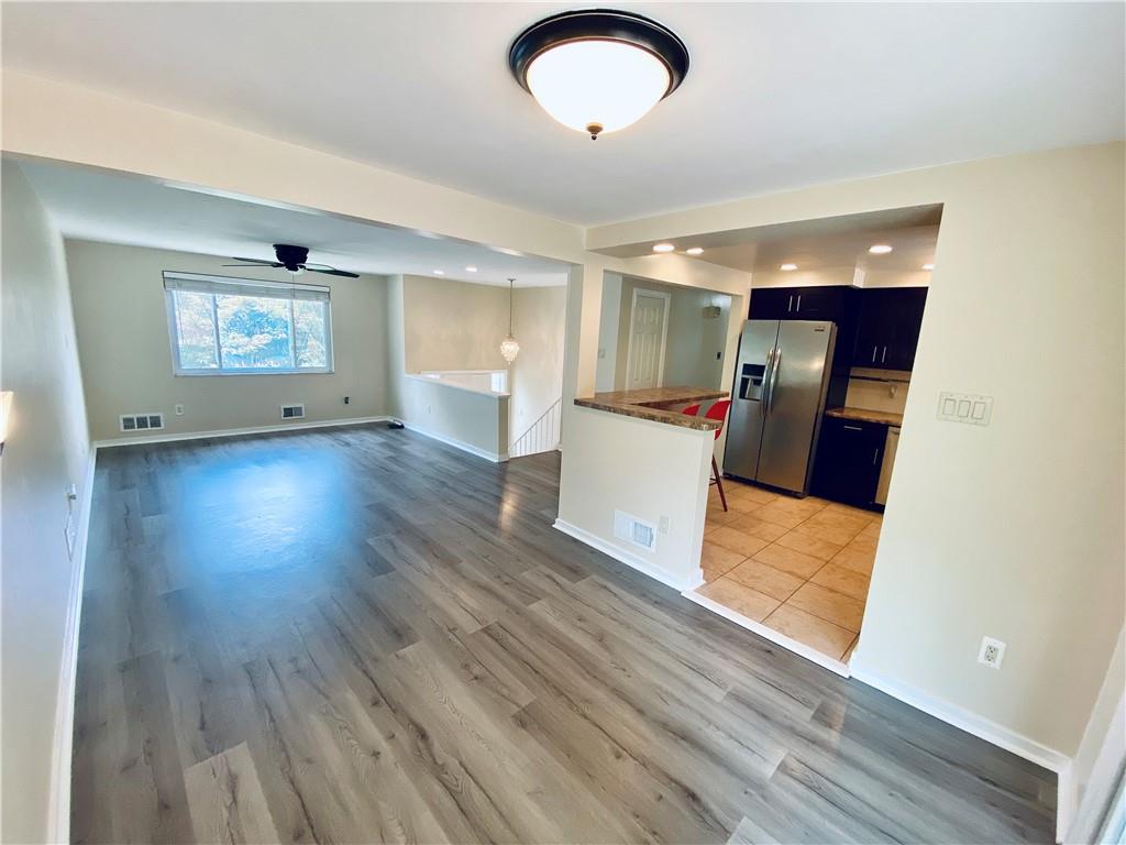 27 Flora Road Pittsburgh, PA 15227 - Photo 4 of 19 a view of a livingroom with furniture and wooden floor