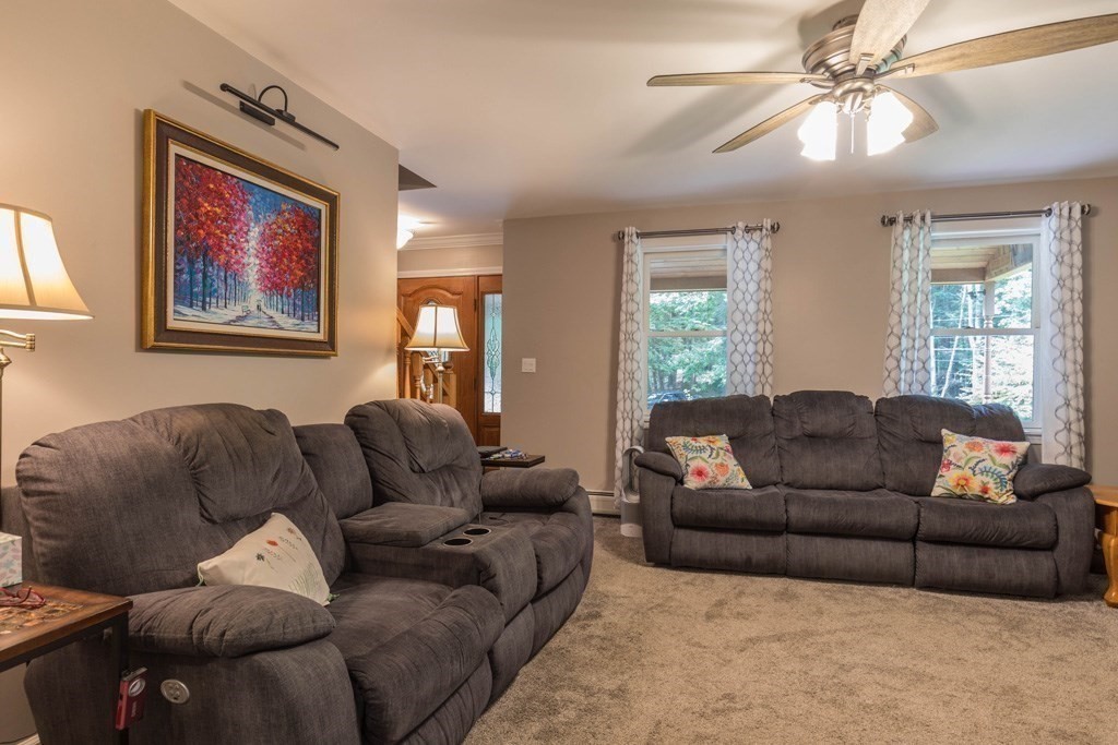 244 E Road Orange, MA 01364 - Photo 9 of 29 a living room with furniture ceiling fan and a window