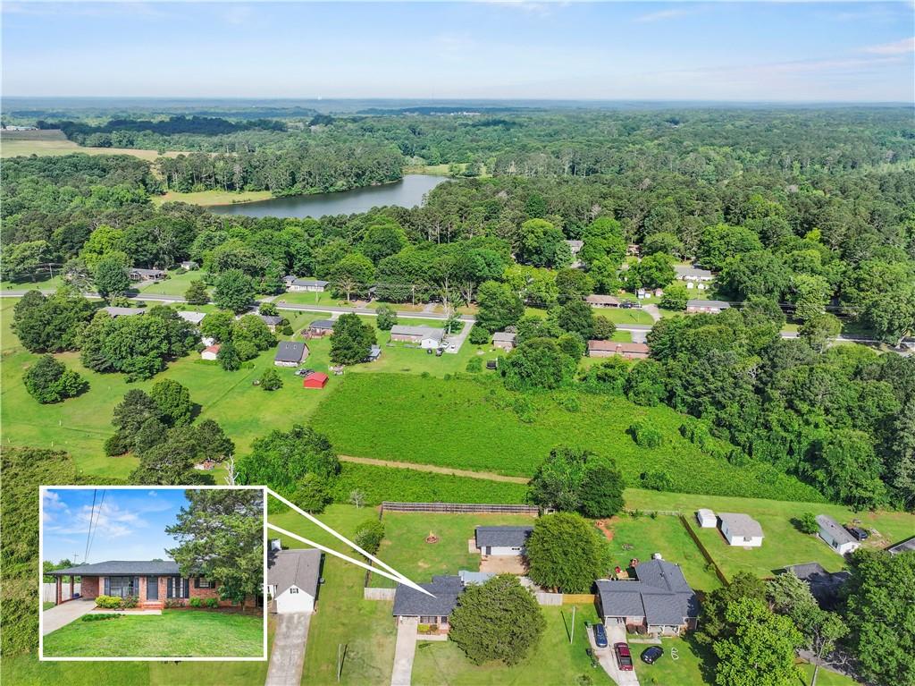 an aerial view of a houses with a yard