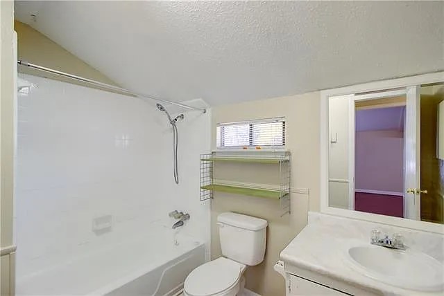 3800 Allegro Lugar Street, Unit 3B Austin, TX 78749 - Photo 9 of 11 a bathroom with a sink a toilet and shower