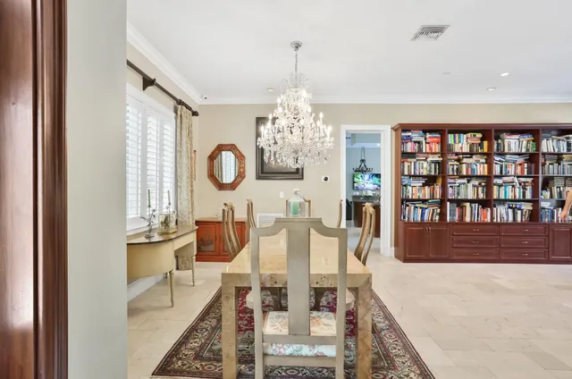a kitchen with stainless steel appliances granite countertop a sink counter space cabinets and living room view