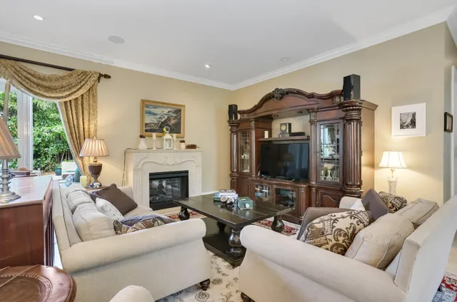 a dining hall with stainless steel appliances a dining table and chairs