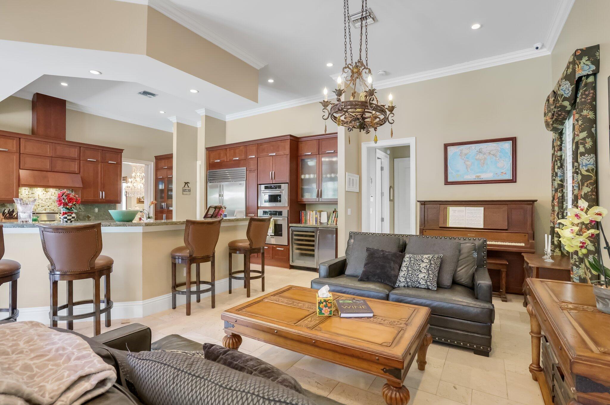 2409 Northeast 12th Street Fort Lauderdale, FL 33304 - Photo 13 of 65 a living room with furniture a chandelier and a chandelier