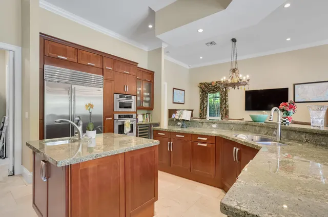 a kitchen with a table and chairs in it